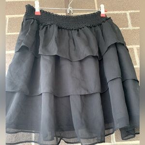 Black ruffle skirt.